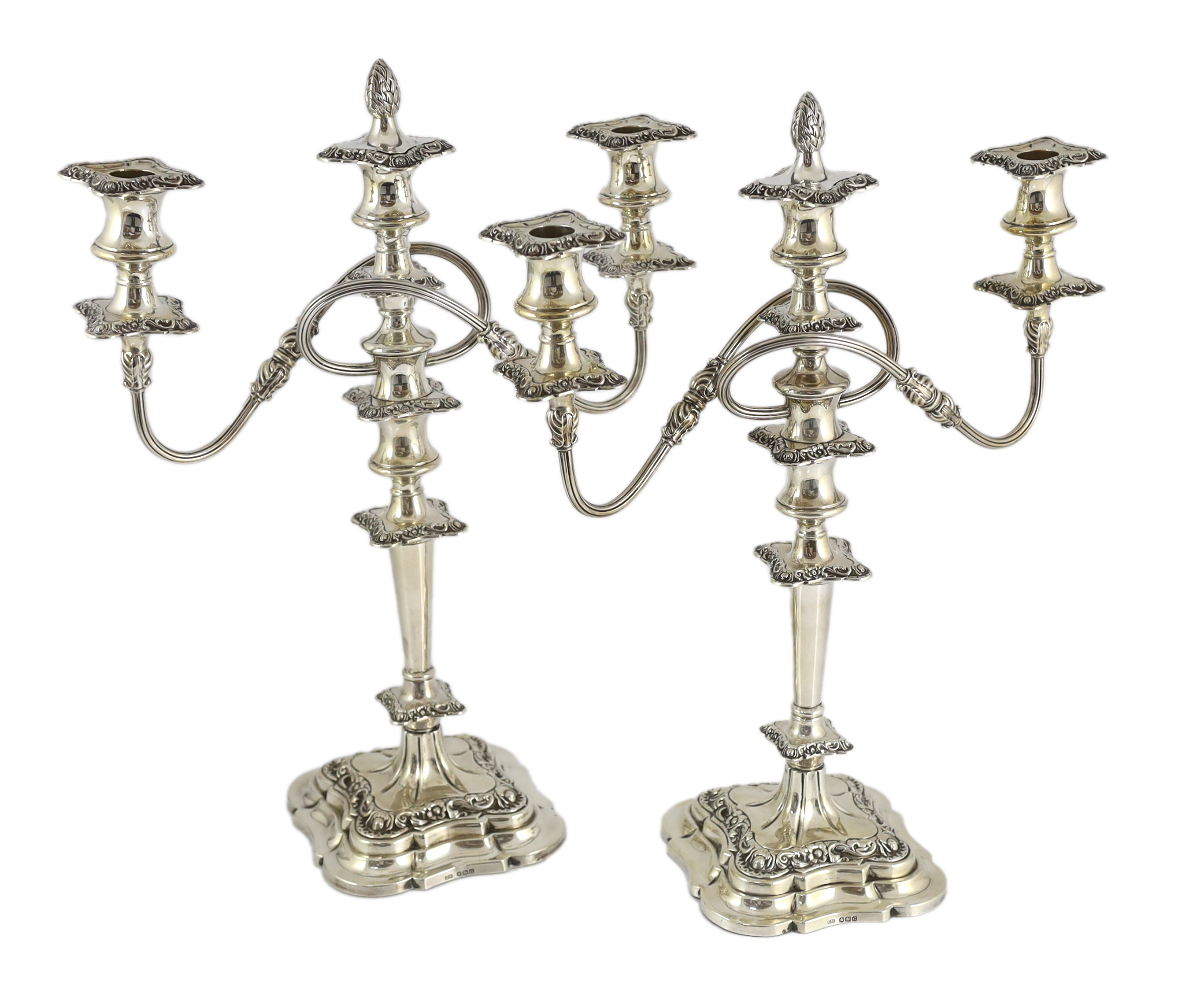 A pair of George VI silver two branch three light candelabra by George Howson